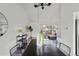 Modern dining area with a sleek table, stylish chairs, and contemporary decor at 1590 S Macon St, Aurora, CO 80012