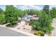 Charming two-story home with lush landscaping, a brick facade, and an attached two-car garage at 1590 S Macon St, Aurora, CO 80012