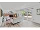 Living room featuring a brick fireplace, sliding glass doors to backyard, and modern decor at 1590 S Macon St, Aurora, CO 80012