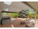 Relaxing brick patio with picnic table and hot tub, perfect for outdoor gatherings at 1590 S Macon St, Aurora, CO 80012