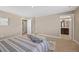 Bedroom featuring neutral tones and carpet with a doorway to the ensuite bathroom at 868 N Quatar St, Aurora, CO 80018