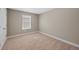 Neutral bedroom featuring carpeted flooring, and a window with blinds, allowing natural light at 868 N Quatar St, Aurora, CO 80018