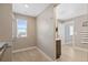 Walk-in closet with carpet flooring, shelving and rack for hanging clothes, and a window at 868 N Quatar St, Aurora, CO 80018