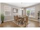 Bright dining room featuring a chandelier, and lots of natural light from the large windows at 868 N Quatar St, Aurora, CO 80018