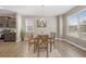 Bright dining room featuring a chandelier, and lots of natural light from the large windows at 868 N Quatar St, Aurora, CO 80018