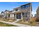 Beautiful two-story home with a stone facade and inviting front porch at 868 N Quatar St, Aurora, CO 80018