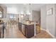 Open kitchen featuring granite island with seating, stainless steel appliances, and adjacent dining area at 868 N Quatar St, Aurora, CO 80018