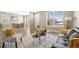 Bright living room with stylish furniture and modern decor open to dining area at 868 N Quatar St, Aurora, CO 80018