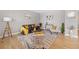 Bright living room featuring modern decor, stylish furniture, and hardwood floors at 868 N Quatar St, Aurora, CO 80018