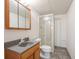 Bathroom features a vanity, a toilet, and a separate glass-enclosed shower at 7732 Xavier Ct, Westminster, CO 80030
