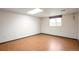 Bedroom includes hardwood flooring, and natural light from the window at 7732 Xavier Ct, Westminster, CO 80030