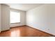 Bright bedroom features wood flooring and natural light from the window at 7732 Xavier Ct, Westminster, CO 80030