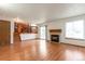 Spacious living room with a cozy fireplace and sliding glass doors to the backyard at 7732 Xavier Ct, Westminster, CO 80030