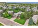 Gorgeous aerial view of a suburban house surrounded by lush greenery and other residences at 10529 Dacre Pl, Lone Tree, CO 80124