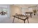 Finished basement includes ping pong and foosball tables, perfect for recreation and entertainment at 10529 Dacre Pl, Lone Tree, CO 80124