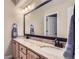 Bathroom featuring double sinks with neutral vanities, granite countertops and neutral walls at 10529 Dacre Pl, Lone Tree, CO 80124