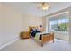 Cozy bedroom with neutral walls and carpet, a window offering backyard views and natural light at 10529 Dacre Pl, Lone Tree, CO 80124