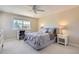 Bedroom with neutral walls and carpet, a desk and a window offering backyard views and natural light at 10529 Dacre Pl, Lone Tree, CO 80124