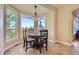 A dining area features a bay window with a view at 10529 Dacre Pl, Lone Tree, CO 80124