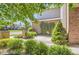 Manicured front yard with brick details and lush greenery, adding curb appeal to the home at 10529 Dacre Pl, Lone Tree, CO 80124