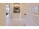 Hallway features neutral walls, trim and carpet with recessed art niche to give a warm and inviting feel at 10529 Dacre Pl, Lone Tree, CO 80124