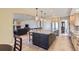 A kitchen features pendant lighting over the island and stainless steel appliances at 10529 Dacre Pl, Lone Tree, CO 80124
