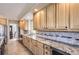 A kitchen with granite countertops, stainless steel appliances, and ample cabinet space at 10529 Dacre Pl, Lone Tree, CO 80124