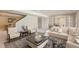 Spacious living room with a cozy seating area, perfect for entertaining guests at 10529 Dacre Pl, Lone Tree, CO 80124
