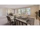 Open-concept living room filled with natural light from large windows and featuring a comfortable seating area at 10529 Dacre Pl, Lone Tree, CO 80124