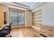 An office has built-in shelves and a desk at 10529 Dacre Pl, Lone Tree, CO 80124