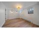 Clean bedroom with wood floors, recessed lights, and natural light from two windows at 395 Zephyr St, Lakewood, CO 80226
