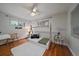 Cozy bedroom featuring a wood floor, natural light and a fun teepee bed frame at 395 Zephyr St, Lakewood, CO 80226