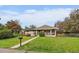 Charming single-story home featuring a covered porch and lush front lawn at 395 Zephyr St, Lakewood, CO 80226