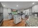 Updated kitchen features granite counters, stainless appliances, and hardwood floors at 395 Zephyr St, Lakewood, CO 80226
