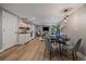Open-concept living space with a fireplace and a dining area with a pendant light fixture at 395 Zephyr St, Lakewood, CO 80226