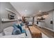 Open-concept living space featuring a bar area and a view to the dining area and living room at 395 Zephyr St, Lakewood, CO 80226