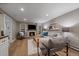 Living room featuring built-in shelves around the fireplace and neutral walls at 395 Zephyr St, Lakewood, CO 80226