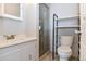 Bright bathroom features a vanity with storage and a tiled glass door shower at 5719 S Lowell Blvd, Littleton, CO 80123