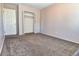 Spacious bedroom with neutral walls, carpet and a double-door closet at 5719 S Lowell Blvd, Littleton, CO 80123