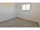Neutral bedroom with gray carpet, one window, and an electric baseboard heater at 5719 S Lowell Blvd, Littleton, CO 80123