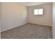 Neutral bedroom with gray carpet, one window, and an electric baseboard heater at 5719 S Lowell Blvd, Littleton, CO 80123