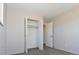 Bright bedroom features an open closet and a doorway leading to another room at 5719 S Lowell Blvd, Littleton, CO 80123
