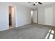 Large bedroom with two closets, neutral walls and a ceiling fan at 5719 S Lowell Blvd, Littleton, CO 80123