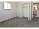 Bright bedroom featuring plush carpet, natural light, neutral paint and closet at 5719 S Lowell Blvd, Littleton, CO 80123