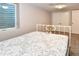 Well-lit bedroom with carpet flooring and a closet at 5719 S Lowell Blvd, Littleton, CO 80123