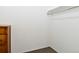 Walk-in closet features carpet and built-in clothes rod perfect for storage at 5719 S Lowell Blvd, Littleton, CO 80123
