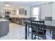 Well-lit kitchen and dining area featuring stainless appliances and a sliding door to the outside at 5719 S Lowell Blvd, Littleton, CO 80123