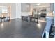 Spacious kitchen and dining area with gray cabinets, stainless steel appliances, and an open layout at 5719 S Lowell Blvd, Littleton, CO 80123