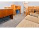 Basement living room featuring a seating area and an adjacent desk and table at 5719 S Lowell Blvd, Littleton, CO 80123