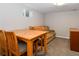 Basement room with dining table, couch, and carpet flooring at 5719 S Lowell Blvd, Littleton, CO 80123